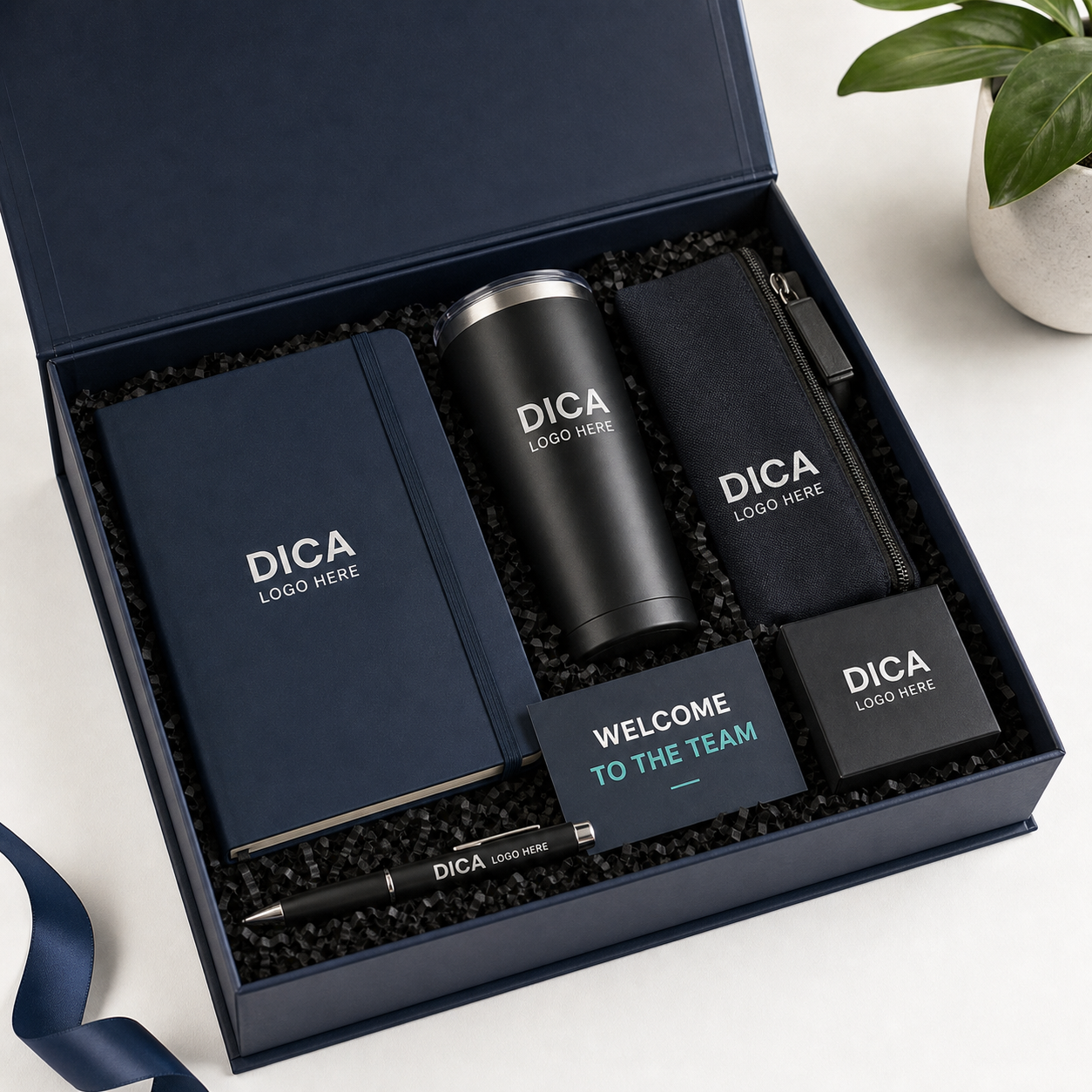 Corporate gift kit with custom box, notebook, tumbler, pen, welcome card, and pouch